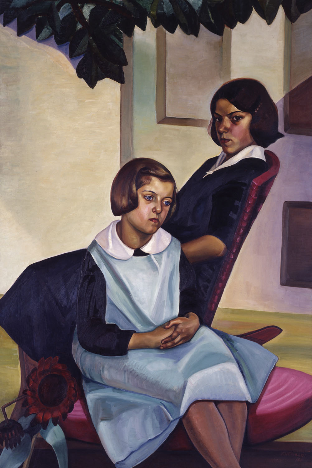 Two young girls sit on pink chairs, possibly on a patio, as the leaves of a plant or tree overhang them. The older girl sits facing left and looks directly at the viewer with a serious gaze. The younger girl sits in front and faces right, looking into the middle distance. They both wear blue pinafores with white collars.