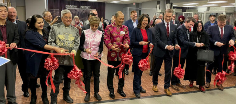 Members of Parliament, Members of the Legislative Assembly, City Council, Alberta's Premier, Calgary's Mayor, Glenbow staff and board, and members of the Chinese community cut the ribbon at the Chinese Cultural Centre.