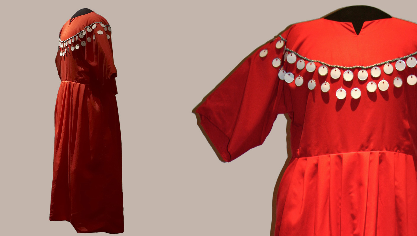 Faye Heavyshield, red dress, 2008 nylon, cotton, metal and paper tags, glass beads. Collection of the Alberta Foundation for the Arts. Photograph from Glenbow exhibit, Tracing History: Presenting the Unpresentable, 2008